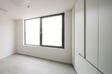 white empty room with window, wardrobe, door at the day.
