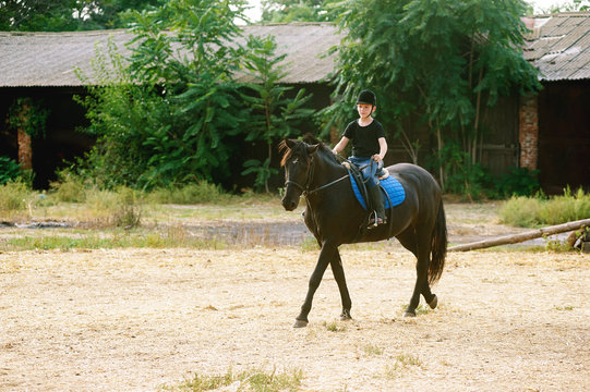 the boy on horseback . Horse riding