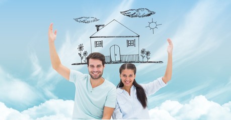 Happy couple with dream house in sky