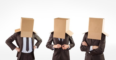 Multiple image of businessmen with cardboard boxes covering head