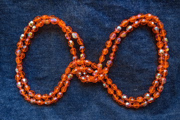 Close up orange plastic bead necklace