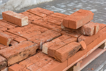 Close up pile of red bricks