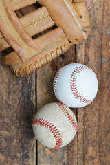 Baseball game. Baseball ball on wooden background.