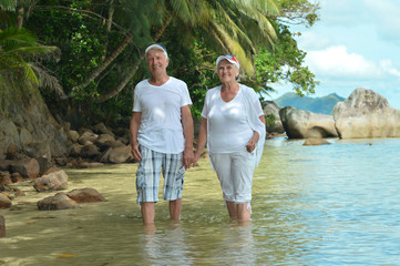 Elderly couple rest at tropical resort