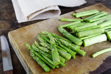 Green asparagus on a wooden background
