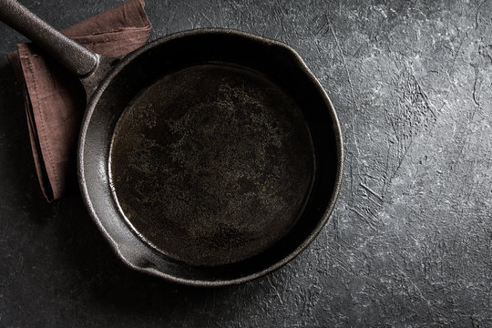 Cast iron pan on black