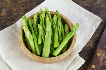Green asparagus on a wooden background
