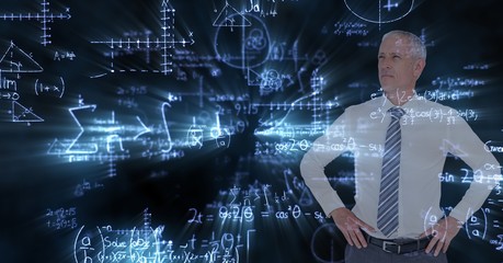 Digital composite image of businessman with math equations