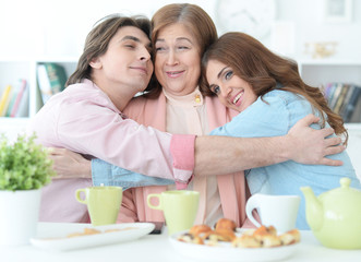 Obraz na płótnie Canvas Happy family drinking tea together