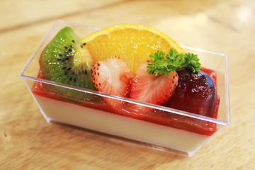 delicious dessert panna cotta in a glass and fresh fruit