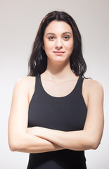 smiling one young woman swimmer swimsuit, arms crossed