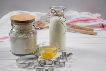 Preparation of gingerbread man cookies. Ingredients, cookie cutters  and kitchen tools 