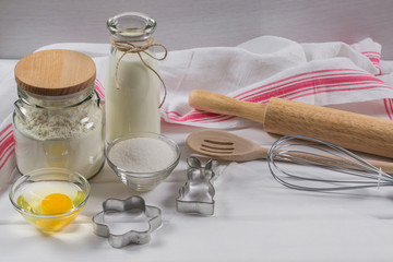 Preparation of gingerbread man cookies. Ingredients, cookie cutters  and kitchen tools 