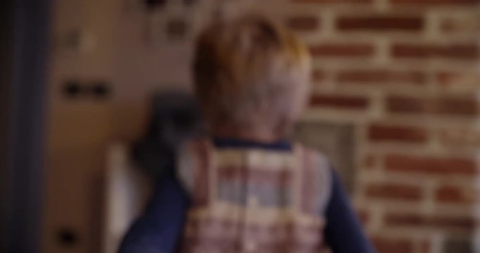 modern family little girl with dad running and playing at home. indoor in modern industrial house. caucasian. 4k handheld slow motion video shot