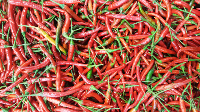 close-up organic fresh red Chili Peppers at fresh market as nature ingredient backgrounds © biggereye