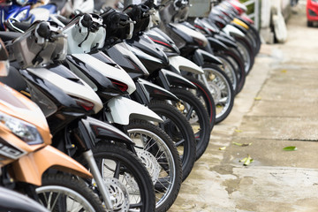 Motorcycles standing in the row at a store, closeup