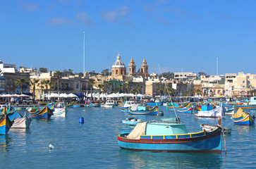 Fototapeta na wymiar colorful fishing boats in Marsaxlokk, Malta