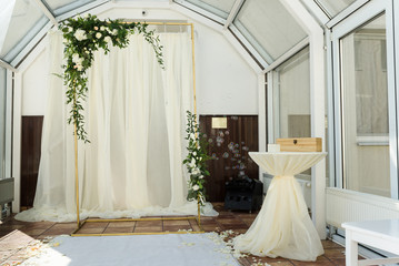 White wedding ceremony decorations indoor. Wedding when bad weather