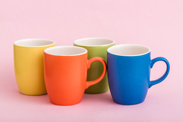 Colorful Coffee Mugs on Pink Background