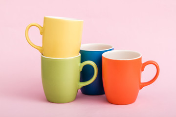 Colorful Coffee Mugs on Pink Background