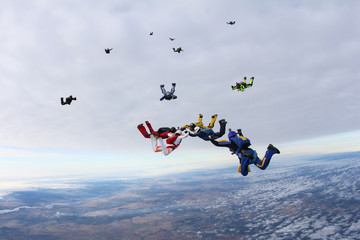 Naklejka na ściany i meble Group skydivers in the sky