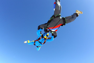 Fototapeta na wymiar Two skydivers in the sky