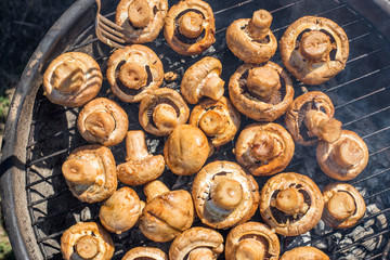 Baking mushrooms on a grill during BBQ season. Food series.