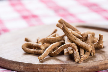 Integral snacks grissini on the wooden table with backlight