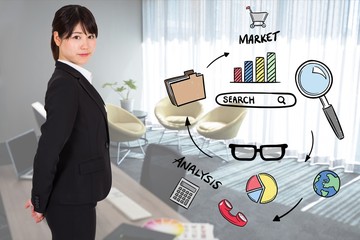 Portrait of businesswoman standing by various icons in office