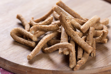 Integral snacks grissini on the wooden table