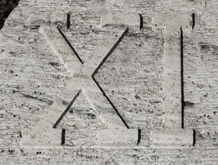 Roman numerals on marble plate, eleven