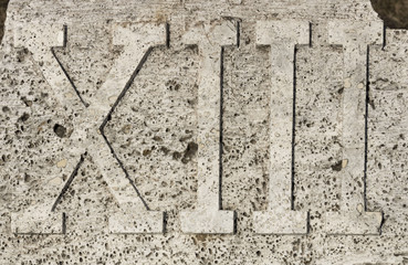 Roman numerals on marble plate, thirteen