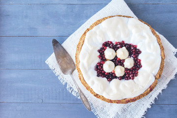 Homemade cake decorated with red berries and merengue. Berry tart