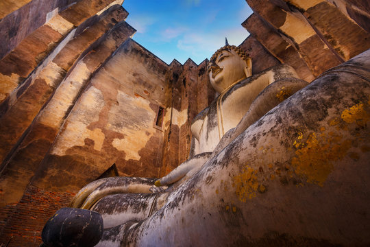 Seated Buddha image at  Wat Si Chum temple in Sukhothai Historical Park, a UNESCO world heritage site in Thailand