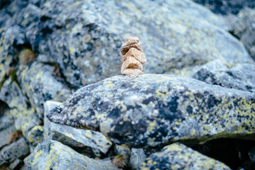 Balanced stone tower. Stability stack. Zen. Rocks around. 