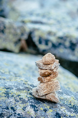 Balanced stone tower. Stability stack. Zen. Rocks around. 