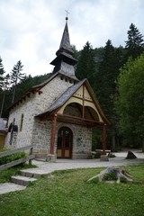Fototapeta na wymiar Cappella del lago di Braies - Val pusteria - Trentino Alto Adige