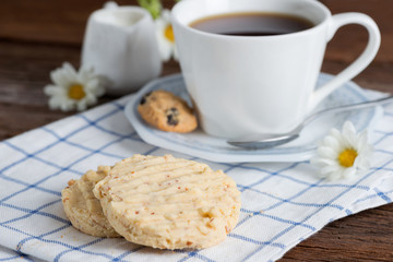 Homemade almond cookies with a cup of coffee.