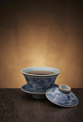 Traditional tea ceremony accessories, teacup with wooden background