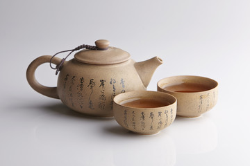 Traditional tea ceremony accessories, teapot and teacup with white background