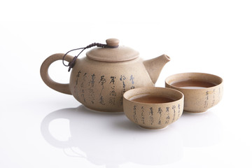 Traditional tea ceremony accessories, teapot and teacup with white background