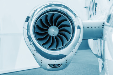 detailed insigh tturbine blades of an aircraft jet engine, colored technical blue, business jet...