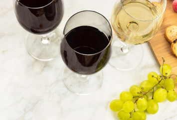 Glasses of red and white wine at tasting