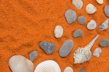 Beautiful background of colored sand, shells, stones and place for an inscription