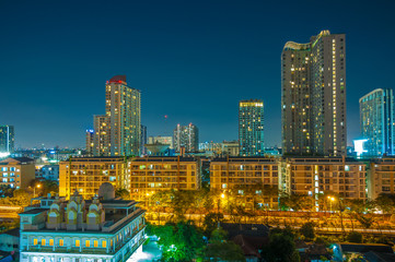 Fototapeta na wymiar At night, Condominium and high rise buildings in the city.