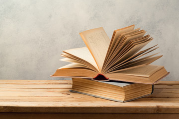 Vintage books on wooden table with copy space