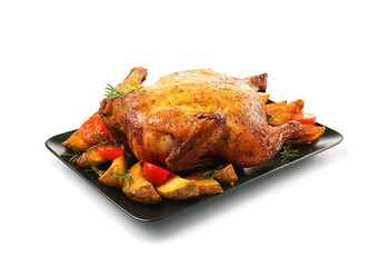 Plate with roasted beer can chicken on white background