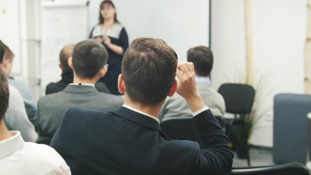 Man in fashion suit at lecture - business seminar