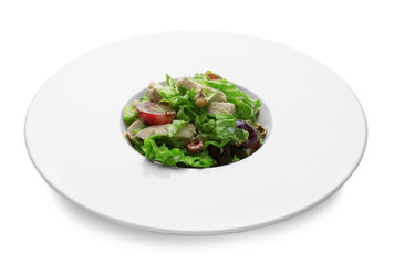 Plate with chicken salad and grapes on white background