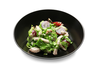 Plate with chicken salad and grapes on white background